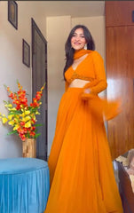 Orange Traditional Lehenga Choli Set With Attractive Blouse Pattern